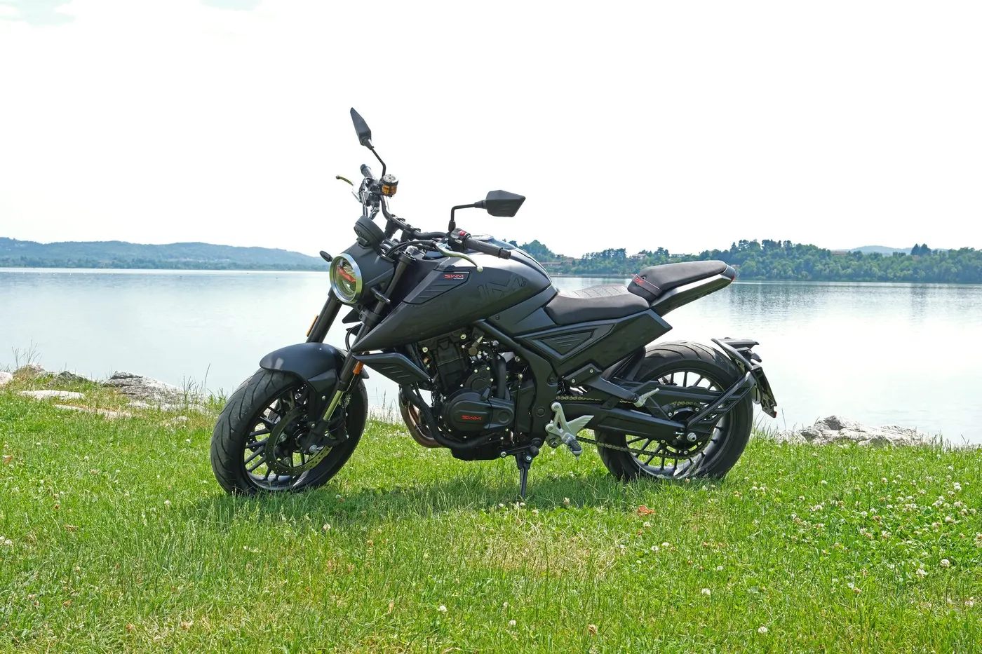 SWM naked motorcycle on the lakeshore